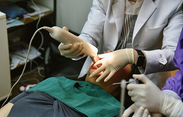 Dentist taking digital impressions