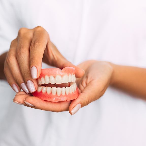 Patient holding model of denture