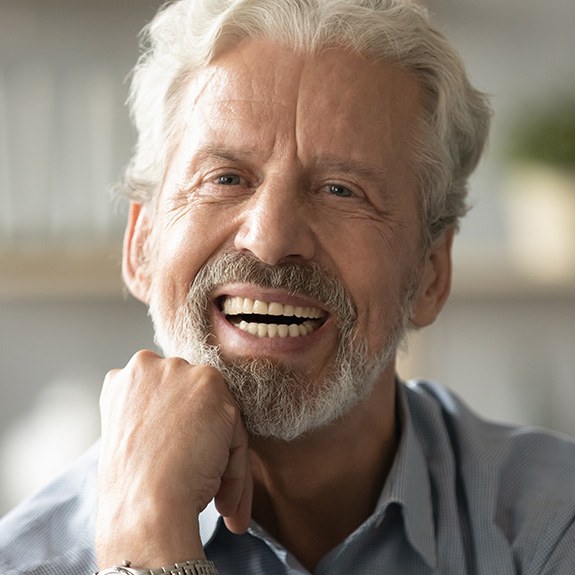 Man with dentures smiling