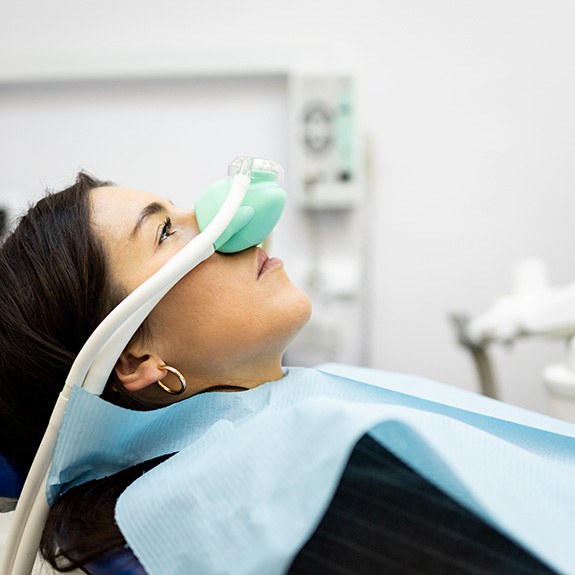 Woman wearing oxygen mask for SMART dentistry 