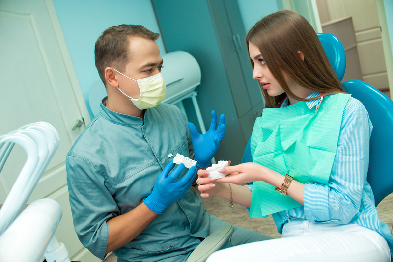 Patient smiling after dental implant surgery