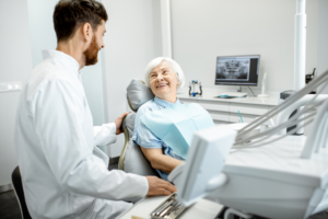 a dental implant patient speaking with their dentist